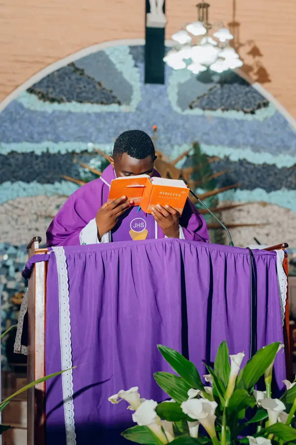 Real CC0 photograph: a priest reading the Bible during worship A priest reading the Bible during a church service, a real CC0 photograph