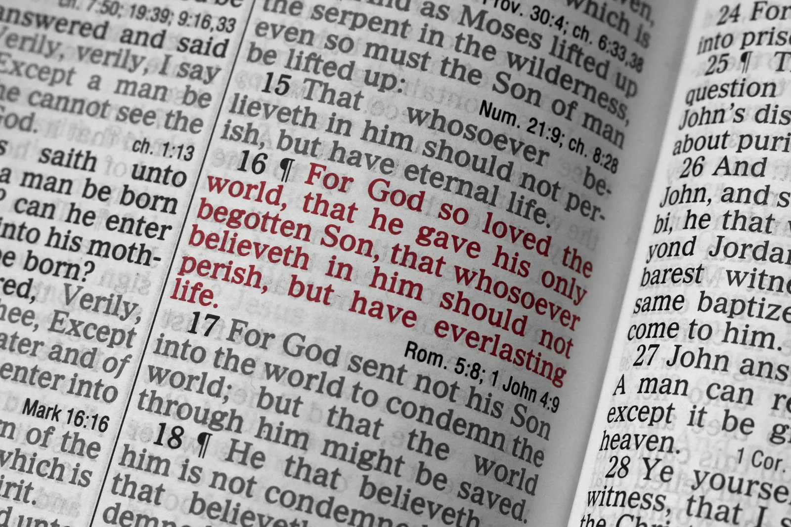 Open Bible focused on John 3:16, showing the words “For God so loved the world”